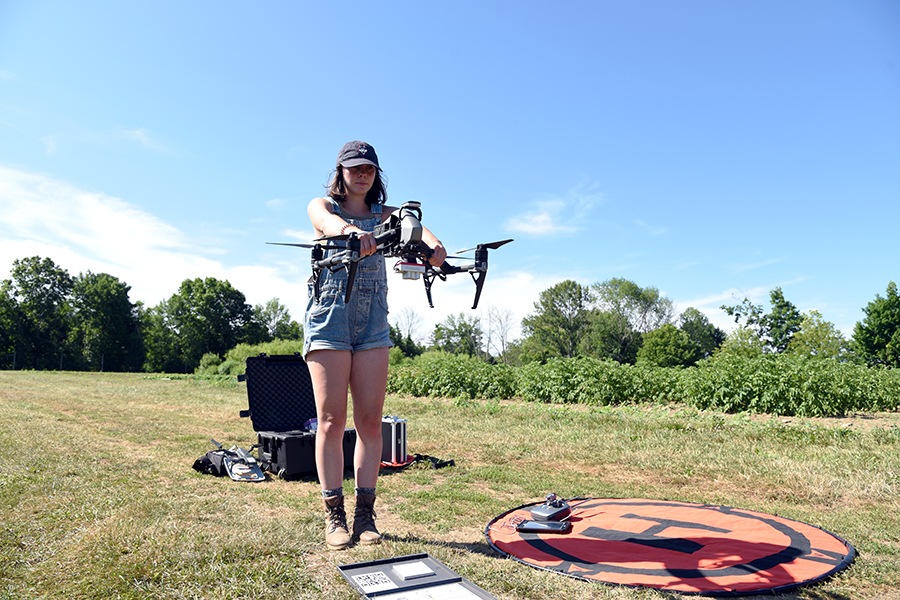 student piloting a drone